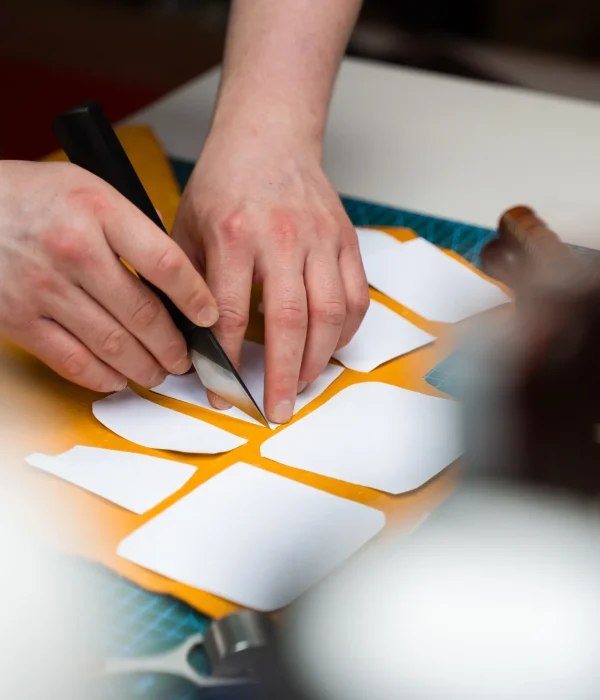 leather-worker-cutting-pattern-with-knife-in-studi-2026-09-25-02-05-19-utc